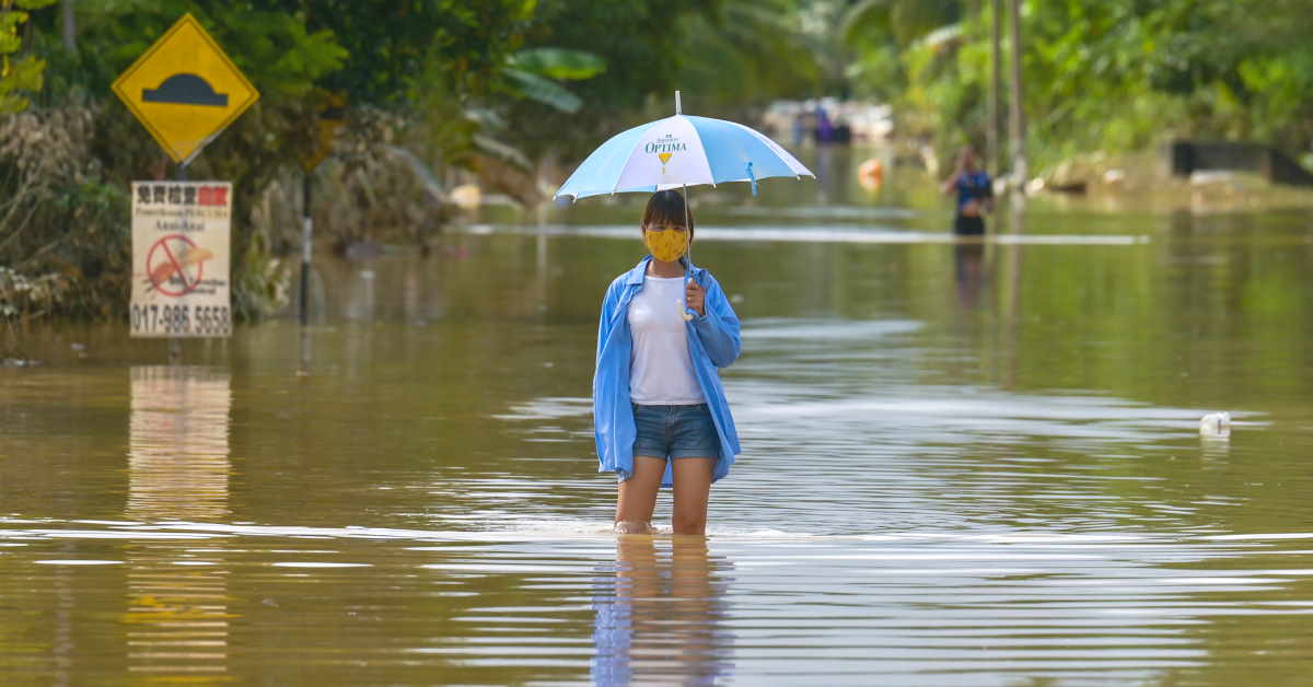 a woman walking in flood
